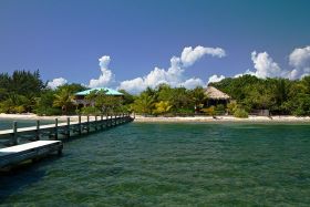 Placencia, Belize pier looking back towards shore – Best Places In The World To Retire – International Living